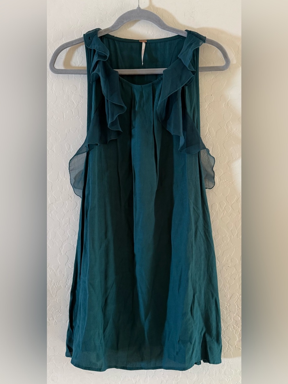 Free People, size 4, teal sleeveless mini dress featuring flowing ruffle details